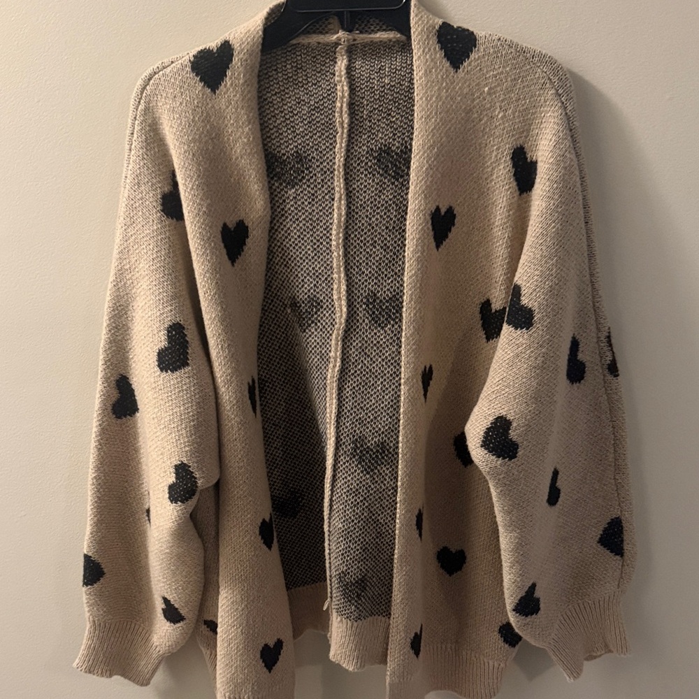 Cozy Beige Cardigan with Black Heart Design
